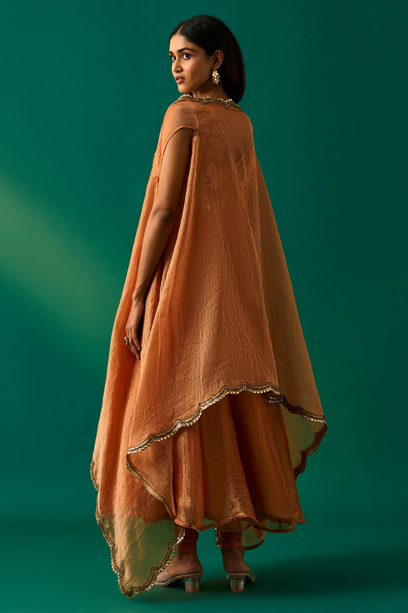 Orange Embroidered Flared Net Dress with Churidar and Cape Set